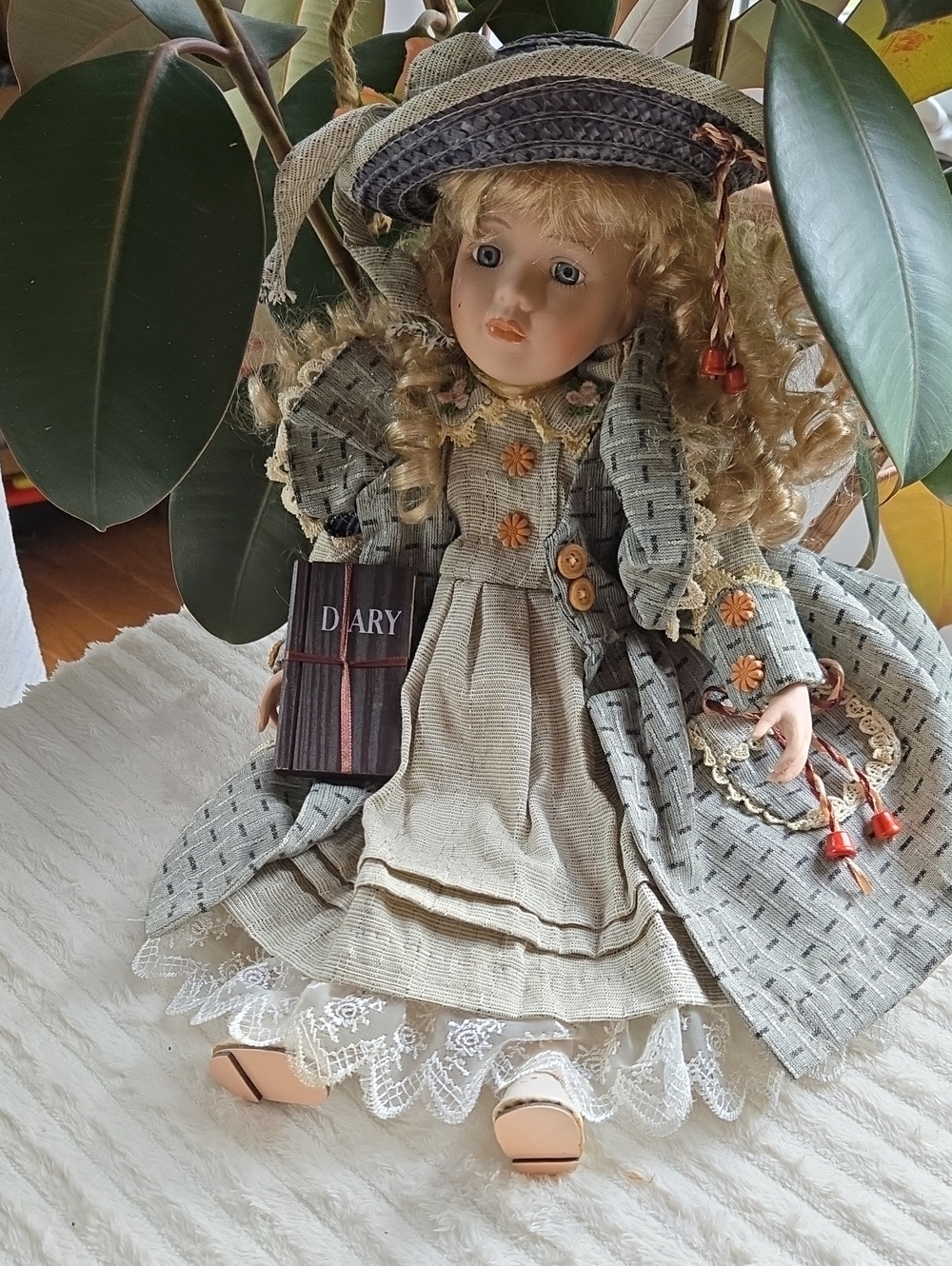 Victorian-Style Porcelain Doll in Beige and Gray Dress